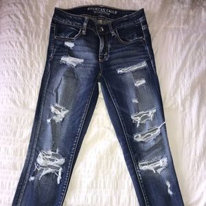 semi cropped dark washed ripped jeans